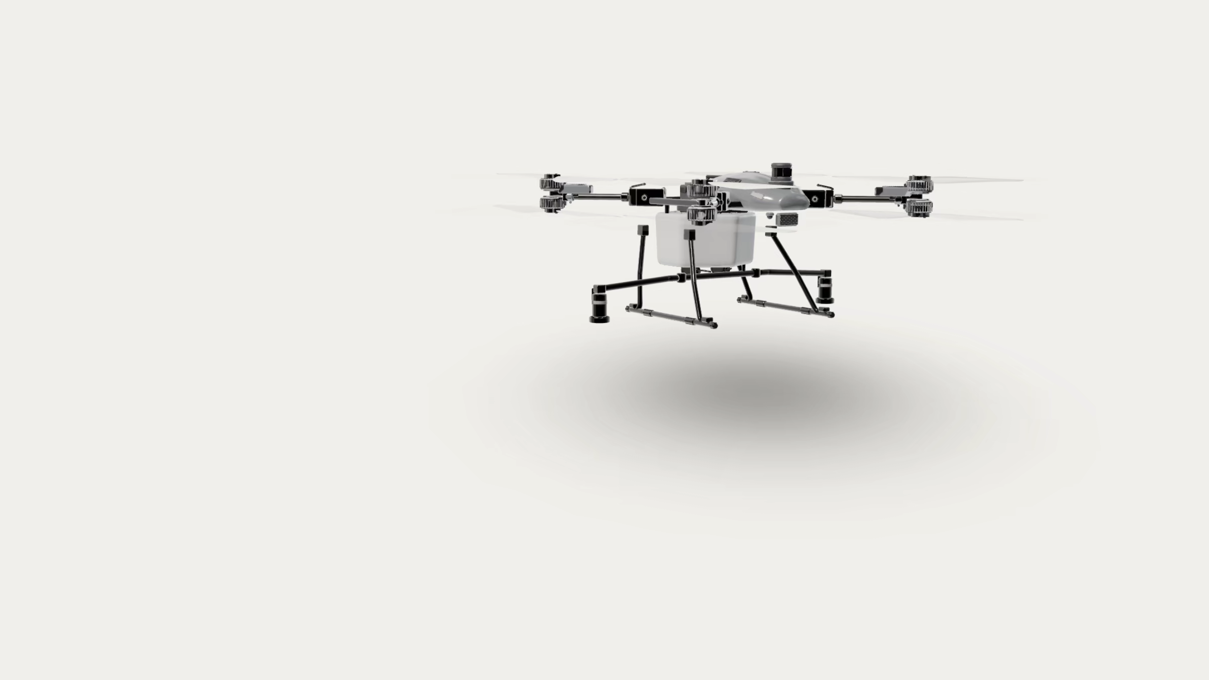 A DJI Agras T100 agricultural drone in a level three-quarter view, arms extended, studio-lit.